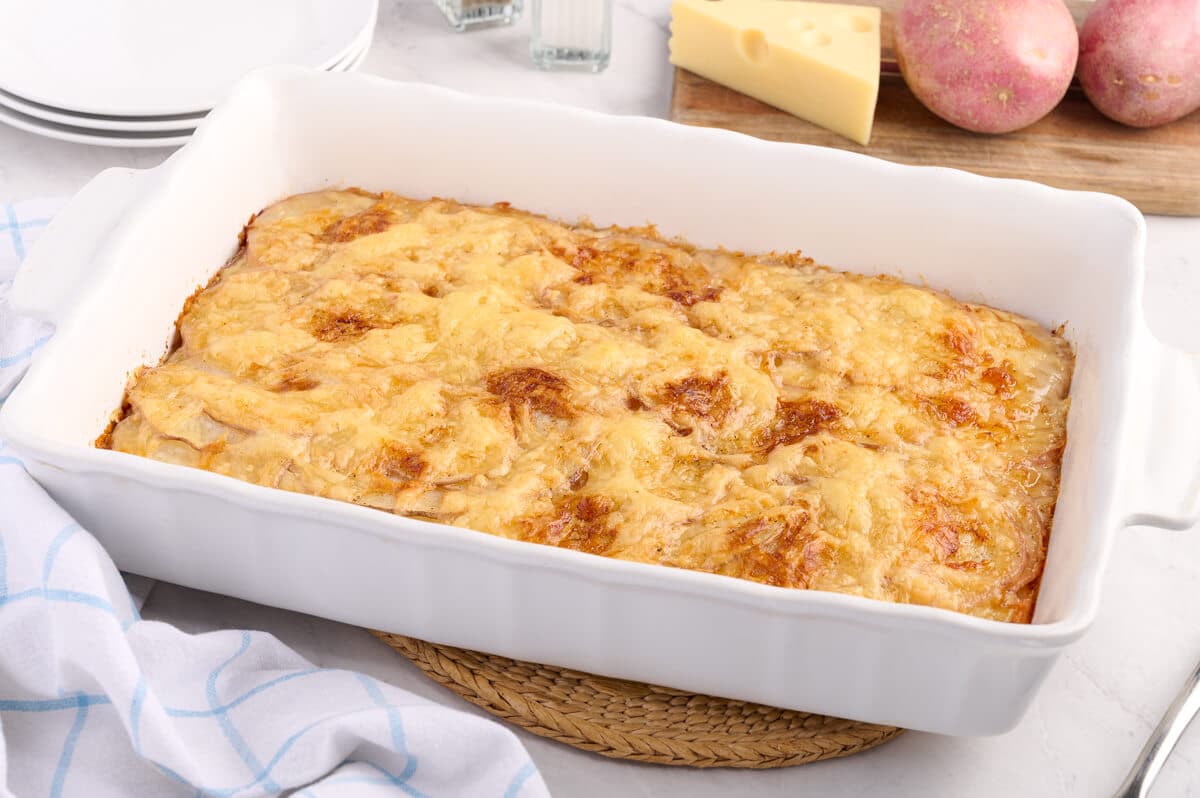 Swiss potatoes in a baking pan.