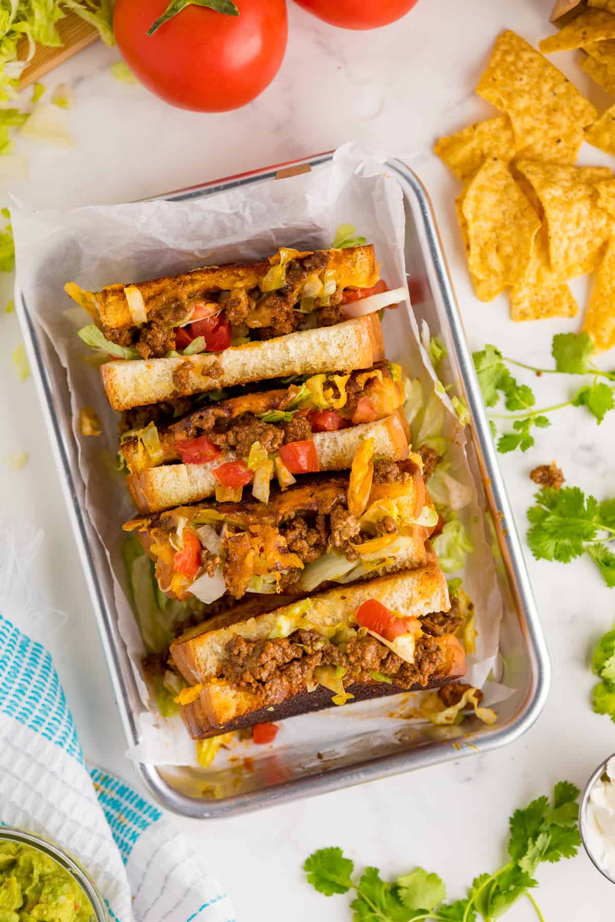 Taco grilled cheese sandwiches on a platter.