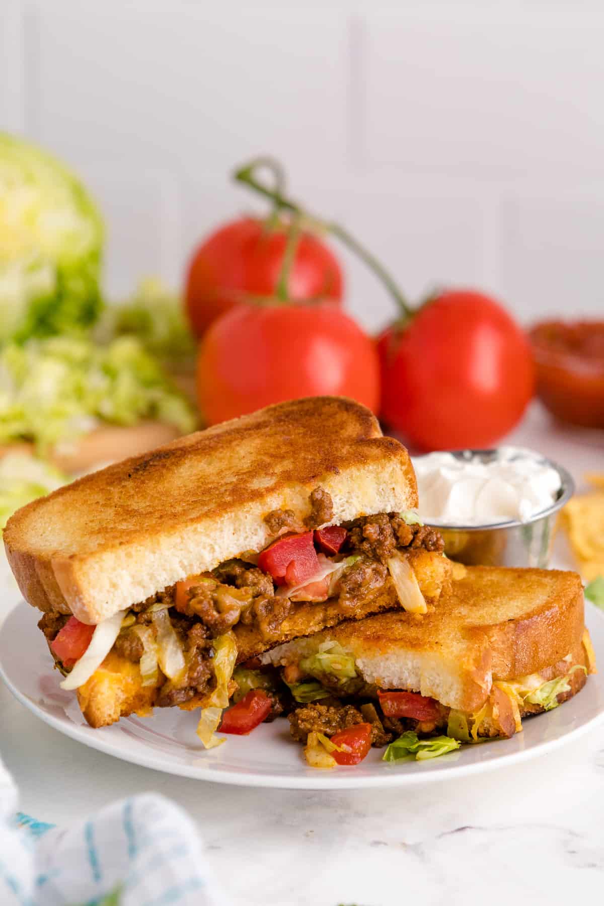 Taco grilled cheese sandwich on a plate.