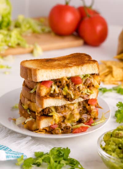 Taco Grilled Cheese stacked on a plate.