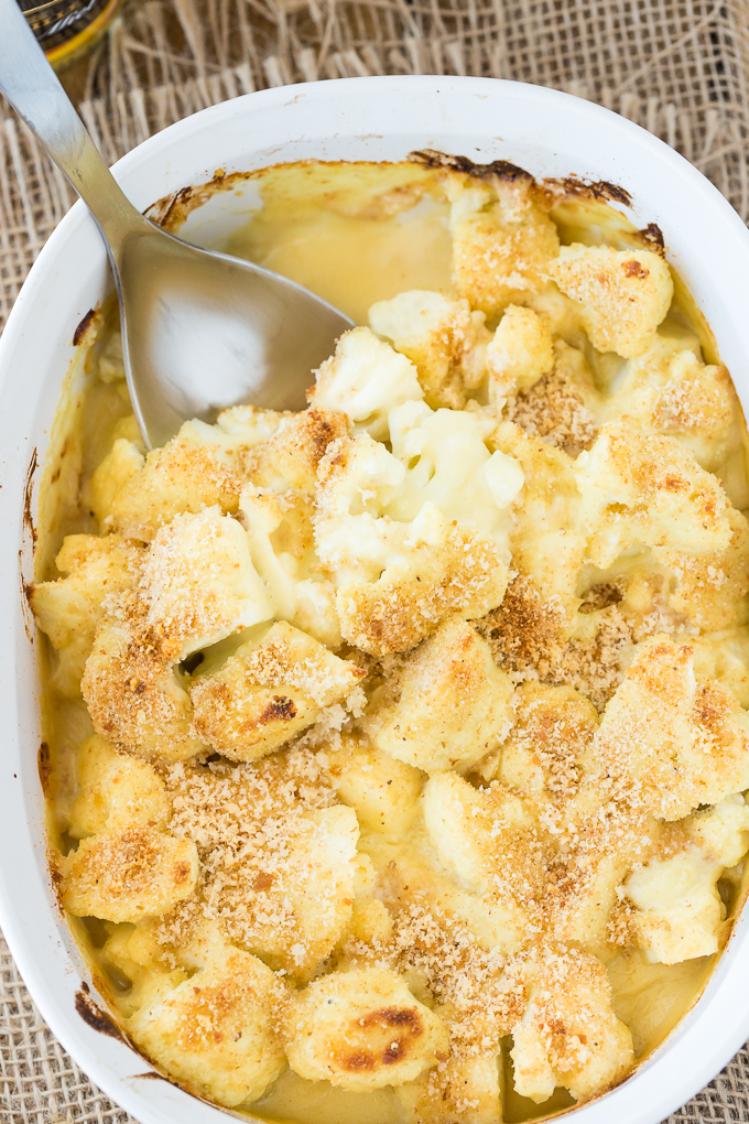 Honey Dijon Baked Cauliflower - This easy side dish is hearty enough for Meatless Monday! This cauliflower casserole recipe is super tangy and covered in breadcrumbs and Parmesan cheese. Yum!