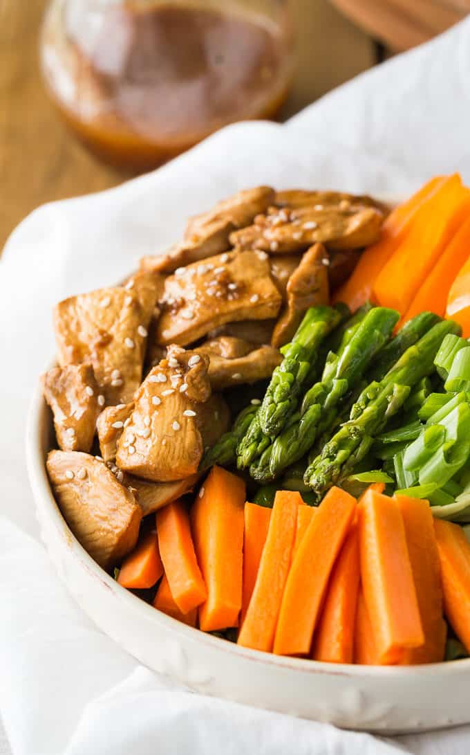 Chicken & Asparagus Salad - A delicious spring salad packed with veggies, seasoned chicken and a tangy Sesame Ginger dressing.