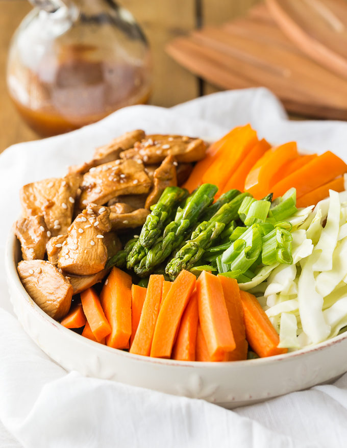 Chicken & Asparagus Salad - A delicious spring salad packed with veggies, seasoned chicken and a tangy Sesame Ginger dressing.