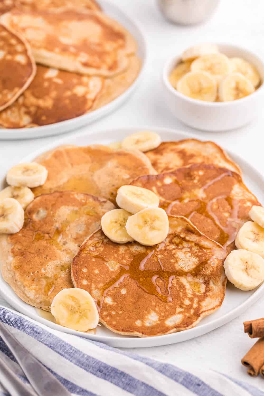 Cinnamon Banana Pancakes - Add some cinnamon and bananas to your next batch of pancakes. My family gobbled this delicious breakfast up in record time!