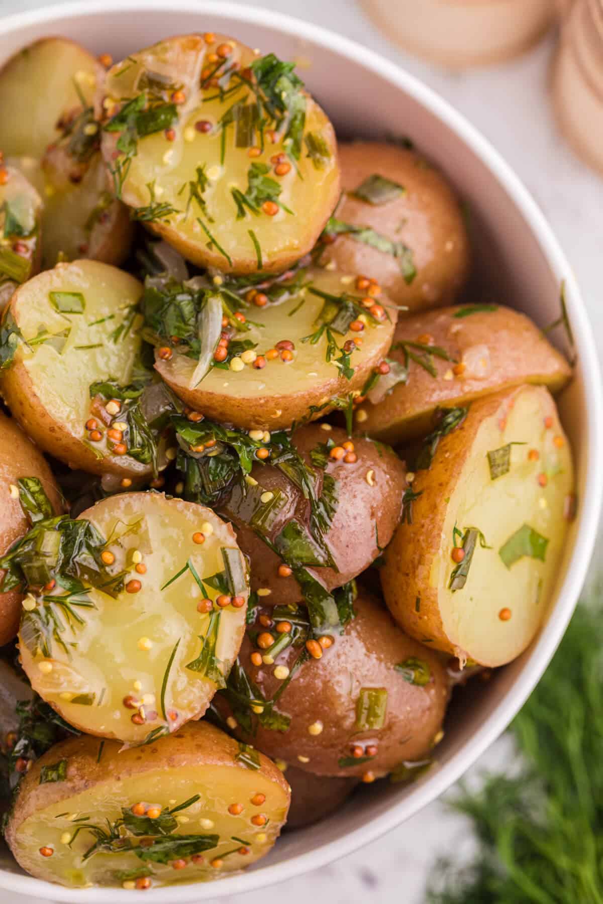 Herb Potato Salad in a white bowl.