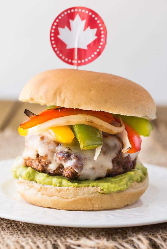 Chicken Fajita Burgers - Skip the beef for this barbecue recipe! These lean cheeseburgers are topped with your favorite fajita veggies and all the spices.