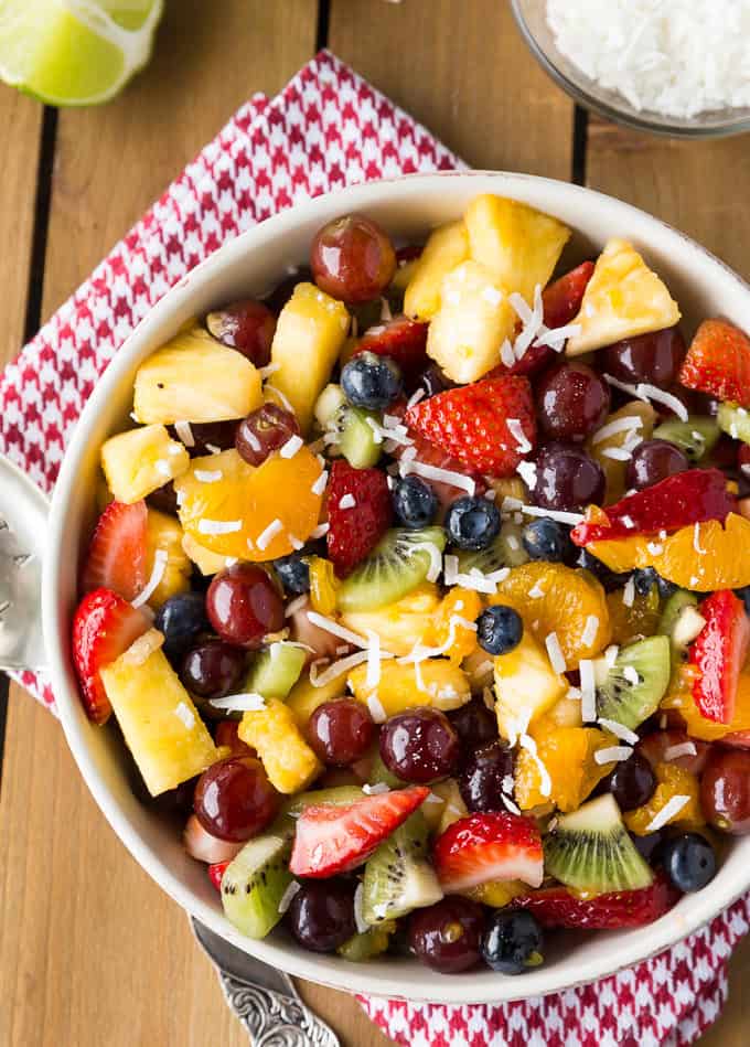 Rainbow Fruit Salad - The most beautiful recipe! Every color is represented with a sweet coconut lime dressing for the most uplifting fruit salad.