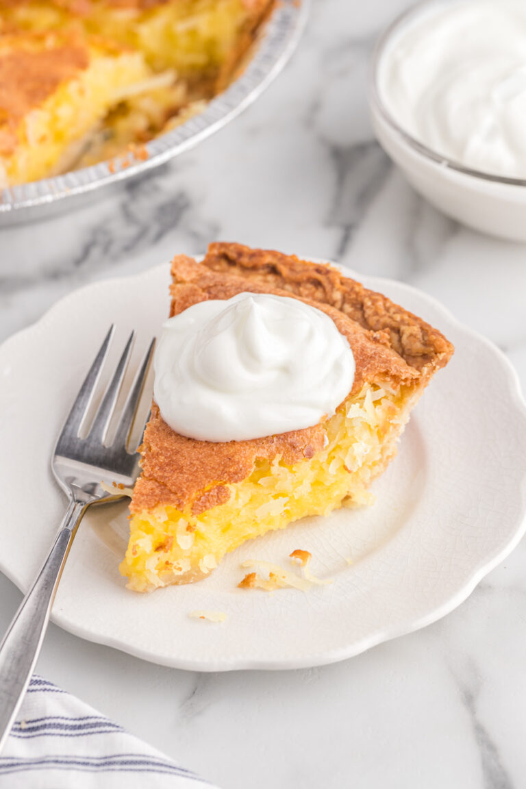 A slice of pie on a plate with a fork.