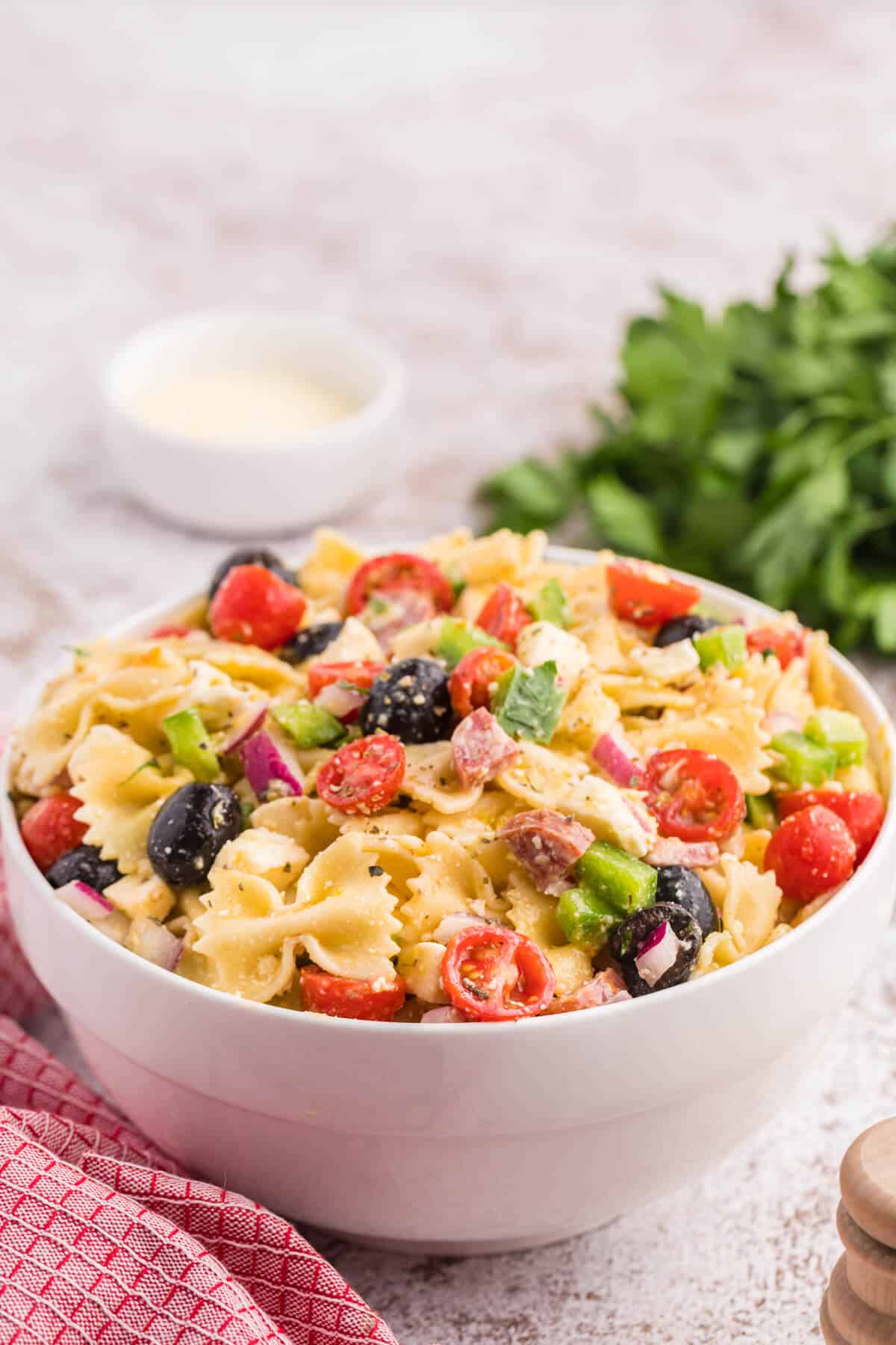 Italian pasta salad in a white bowl.
