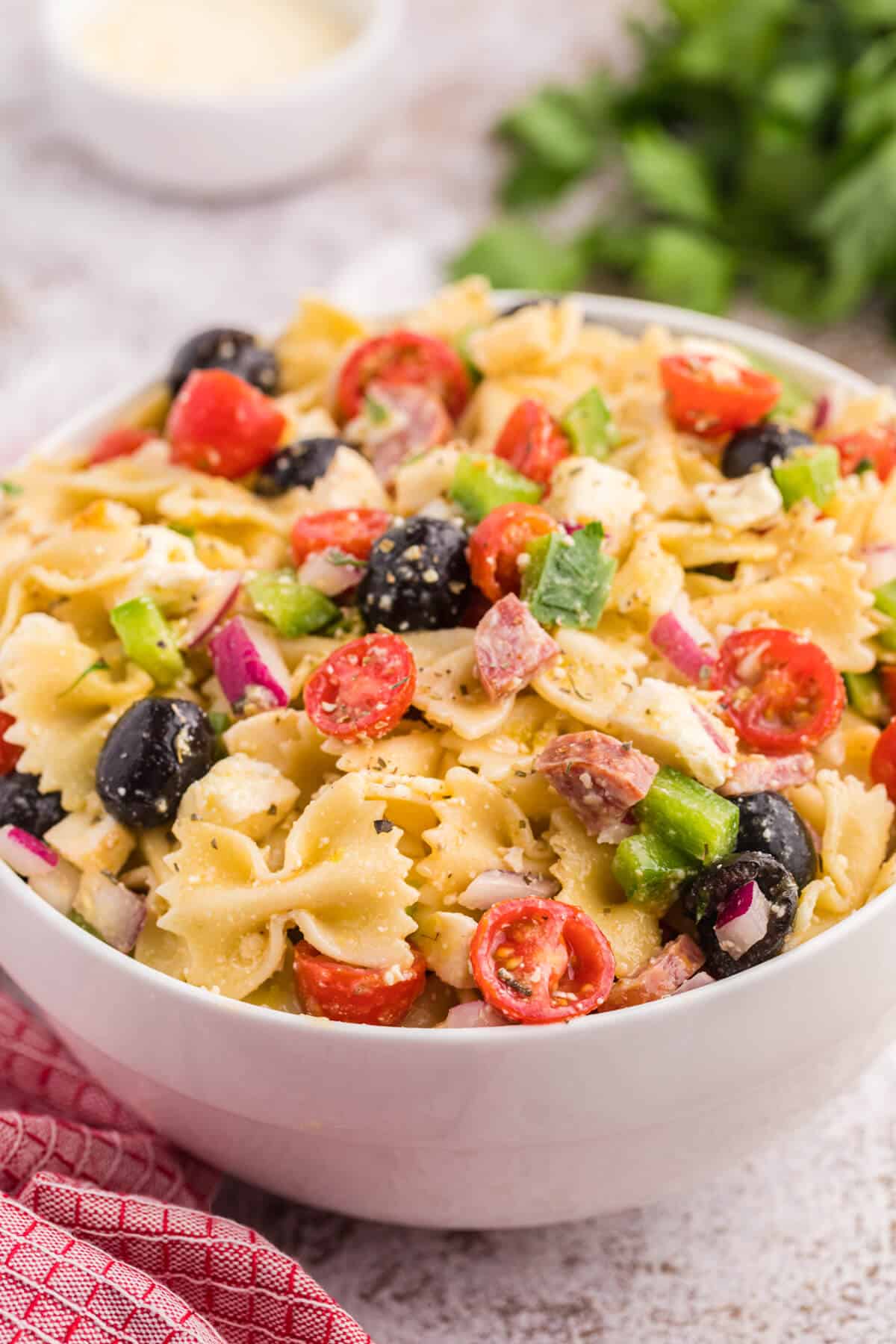 Italian pasta salad in a white bowl.