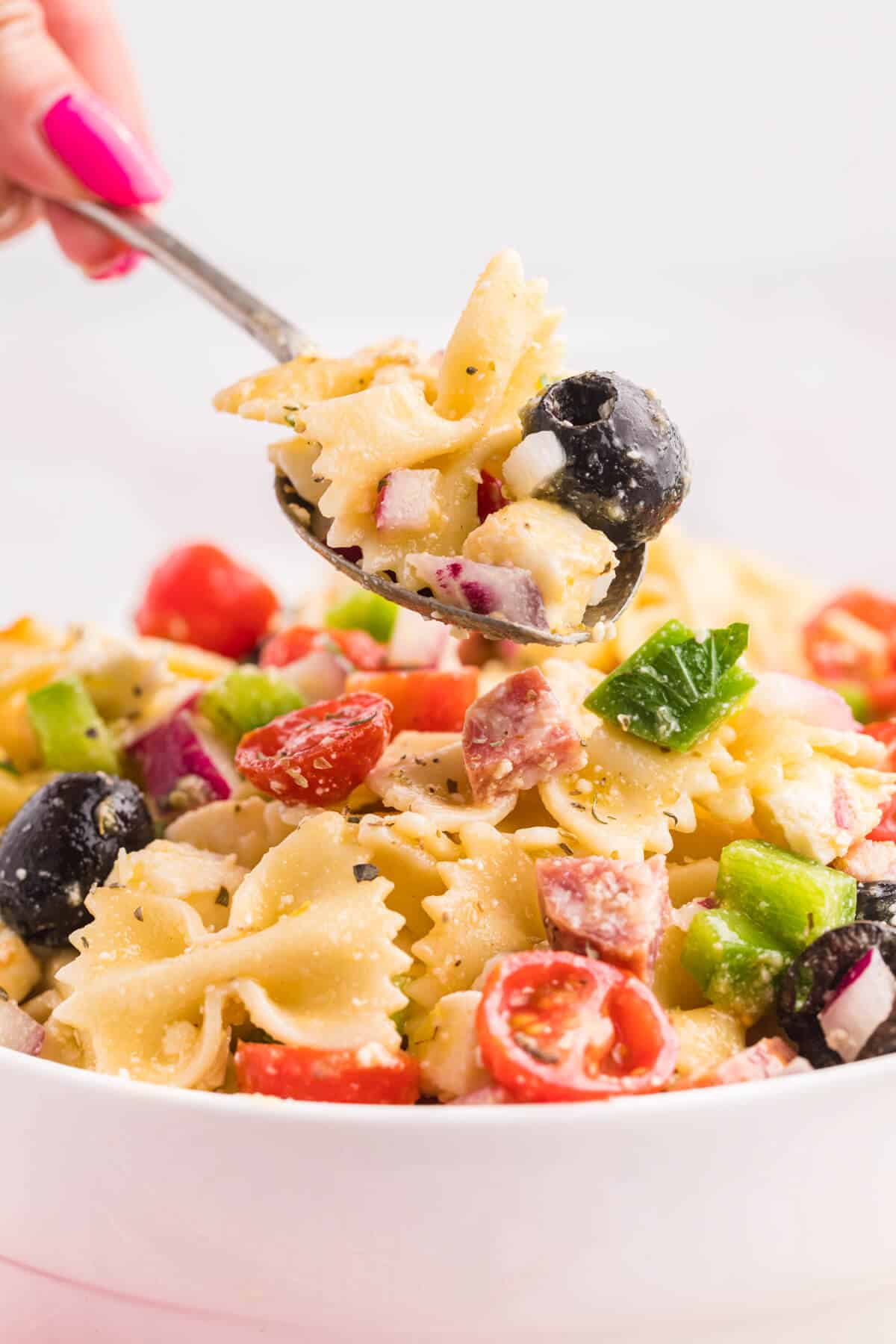 Italian pasta salad on a spoon.