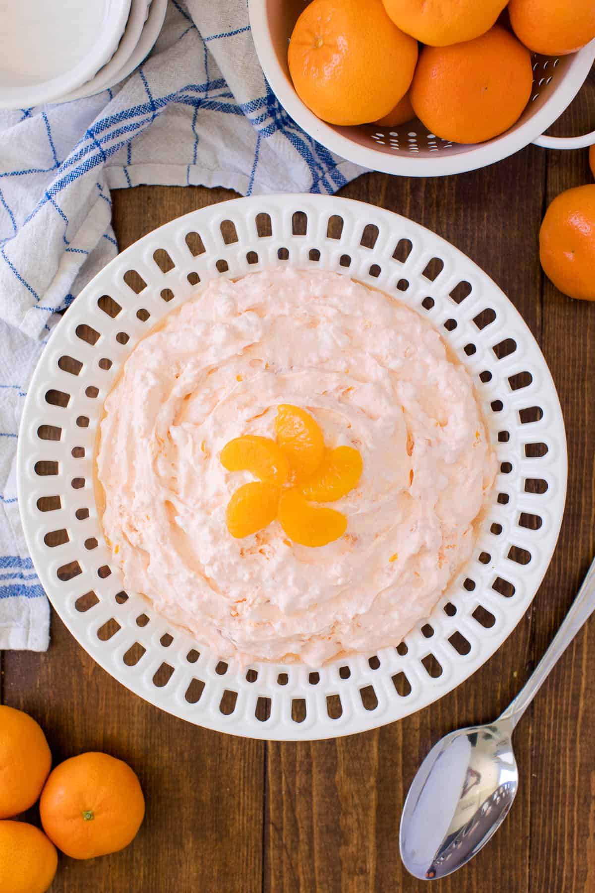 Orange Creamsicle Salad - The fluffiest dessert! You'll dream about your childhood ice cream cravings with this creamy fruit salad with cottage cheese, Jello, and mandarin oranges.