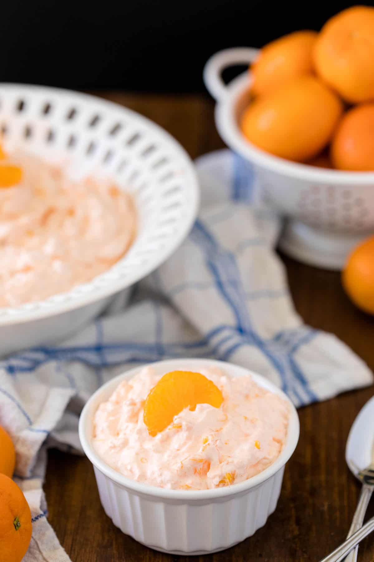 Orange Creamsicle Salad - The fluffiest dessert! You'll dream about your childhood ice cream cravings with this creamy fruit salad with cottage cheese, Jello, and mandarin oranges.