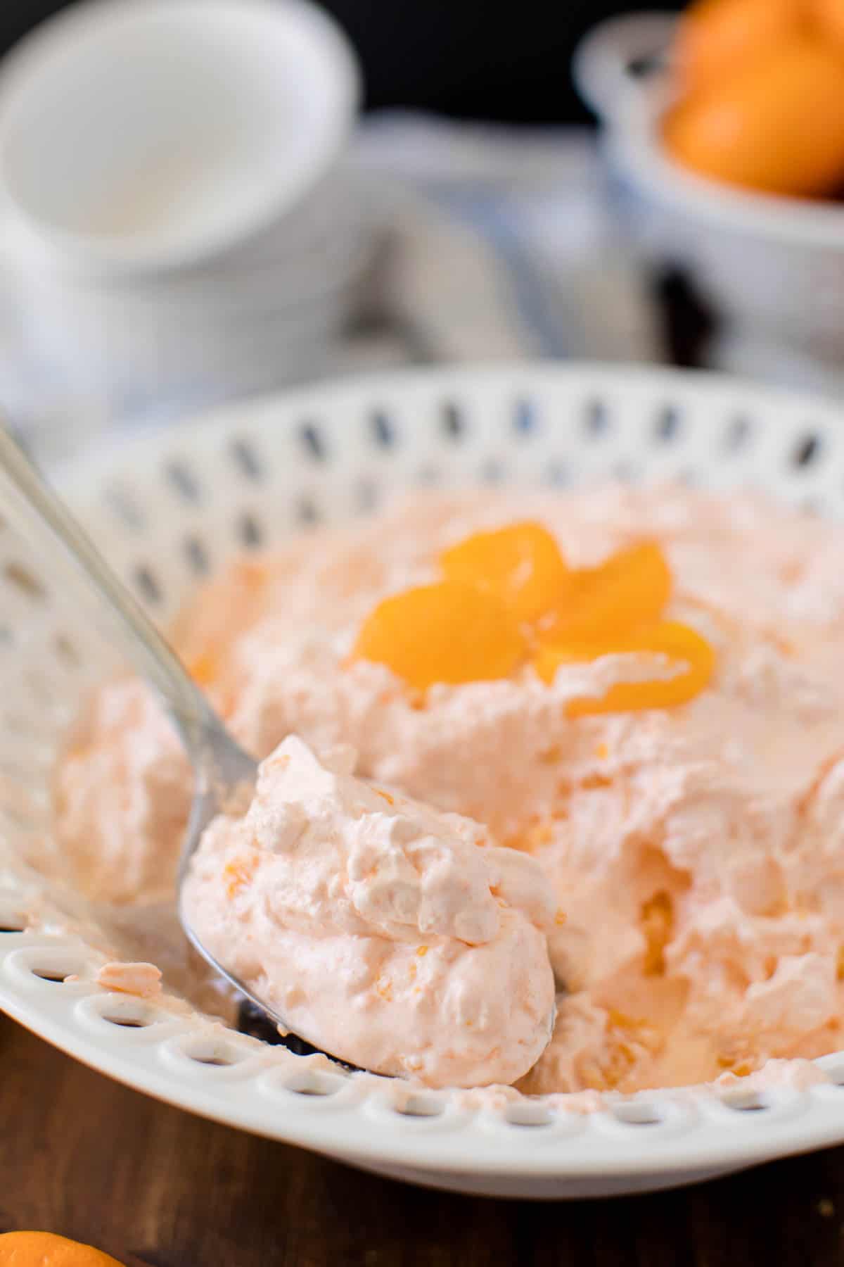 Orange Creamsicle Salad - The fluffiest dessert! You'll dream about your childhood ice cream cravings with this creamy fruit salad with cottage cheese, Jello, and mandarin oranges.