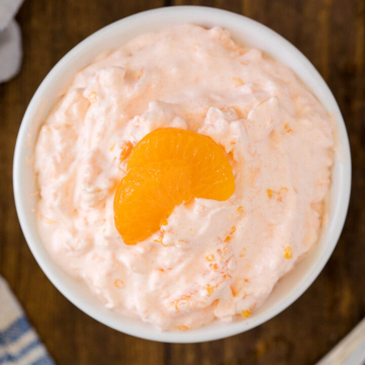 Orange Creamsicle Salad - The fluffiest dessert! You'll dream about your childhood ice cream cravings with this creamy fruit salad with cottage cheese, Jello, and mandarin oranges.