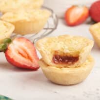 A stack of two strawberry coconut tarts.