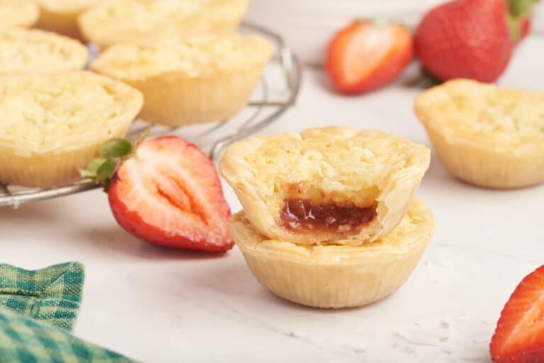 A stack of two strawberry coconut tarts.