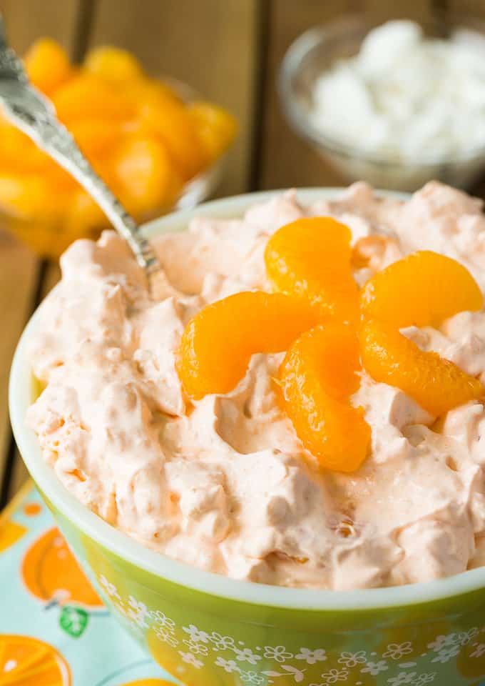 Orange Creamsicle Salad - Sweet, creamy, fluffy and oh so good! This old-fashioned recipe will be a hit at your family's dinner table.