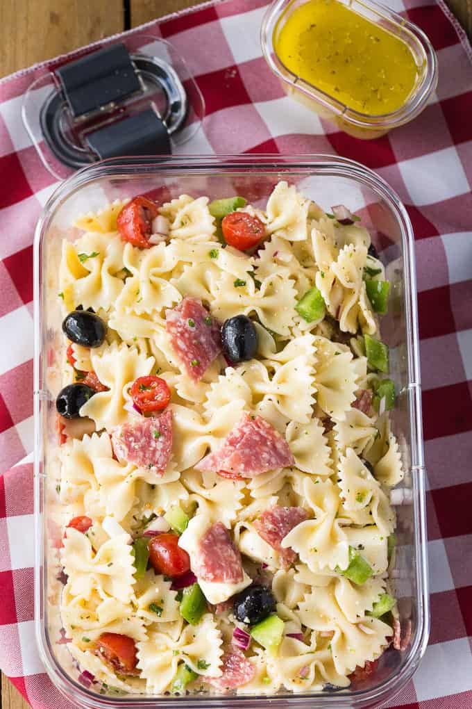 Italian Pasta Salad - The best BBQ side dish! This pasta salad recipe is made with a simple homemade Italian vinaigrette and filled with peppers, tomatoes, olives, and salami.