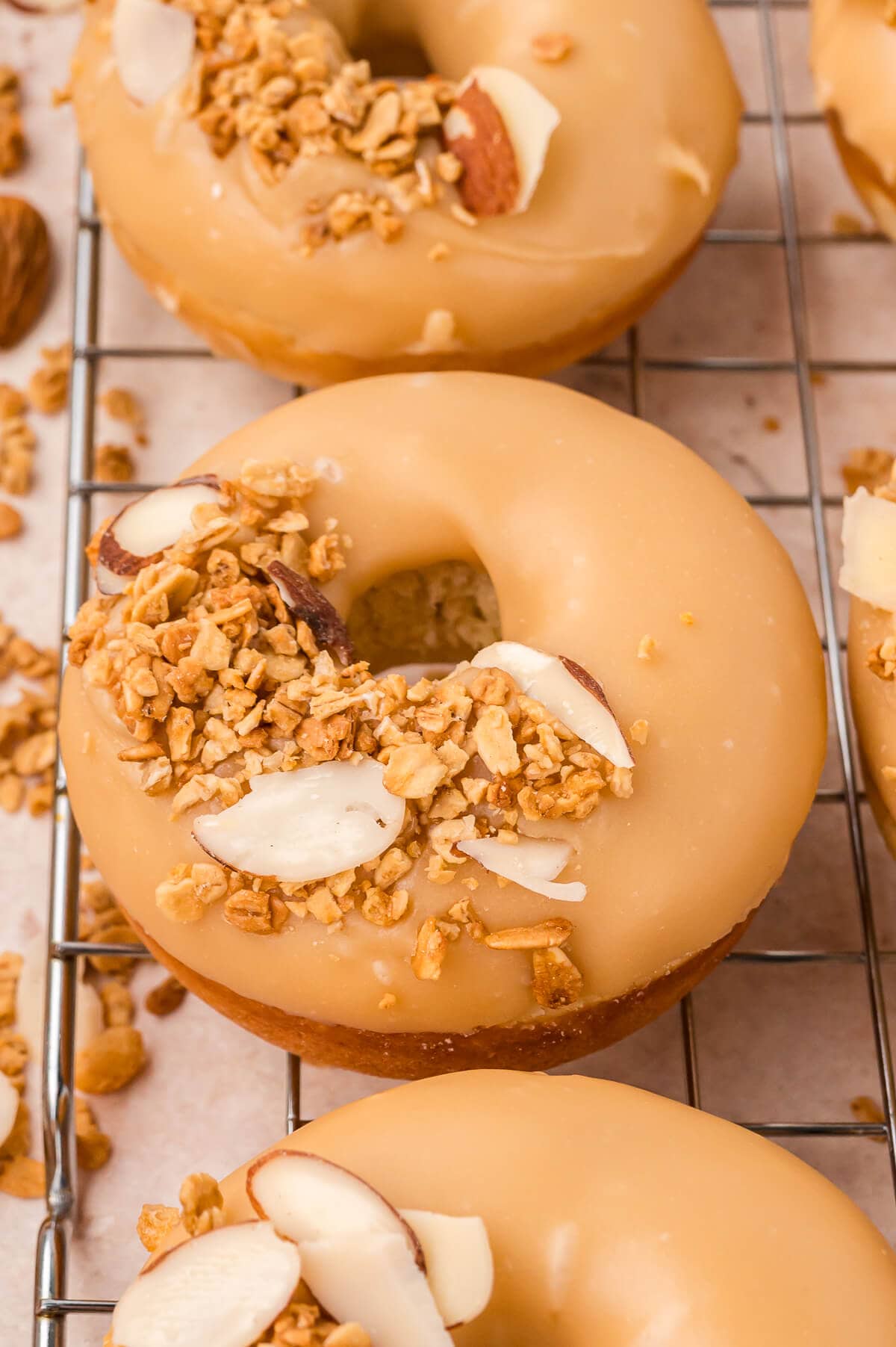 Baked brown sugar glazed donuts on a wire rack.