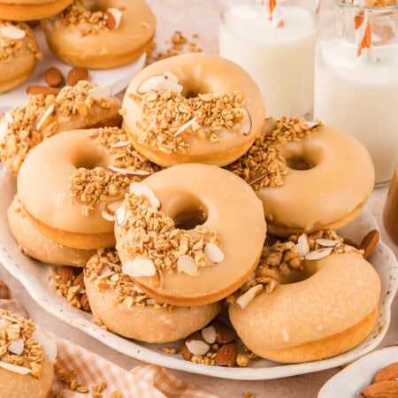 A pile of donuts on a platter.