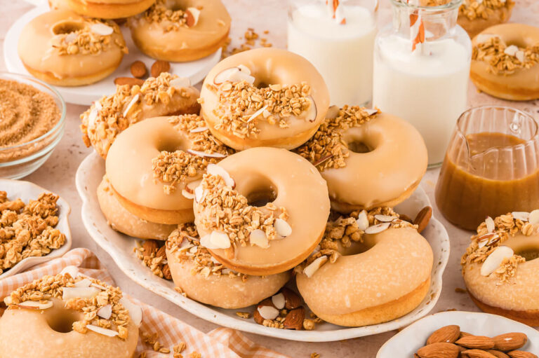 A pile of donuts on a platter.