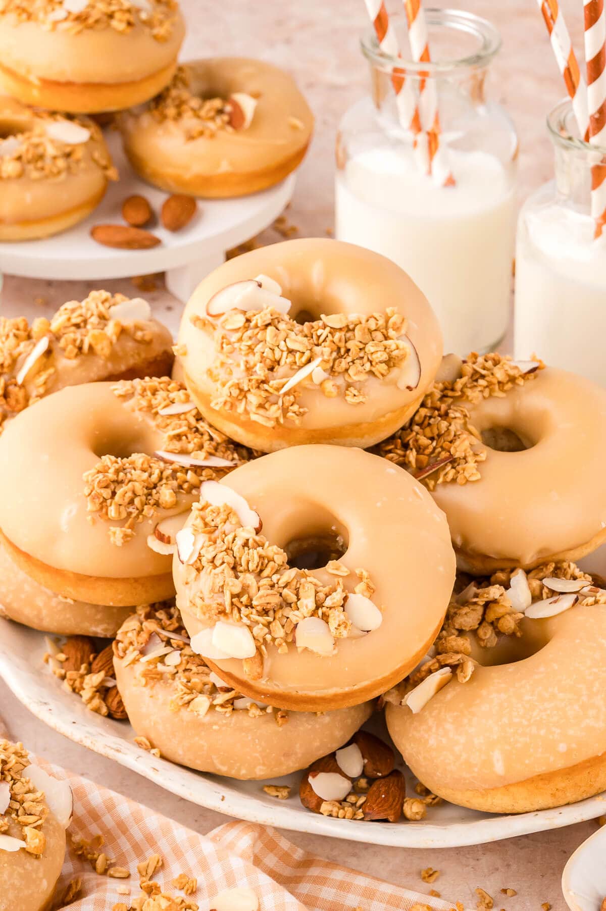 A pile of donuts on a platter.