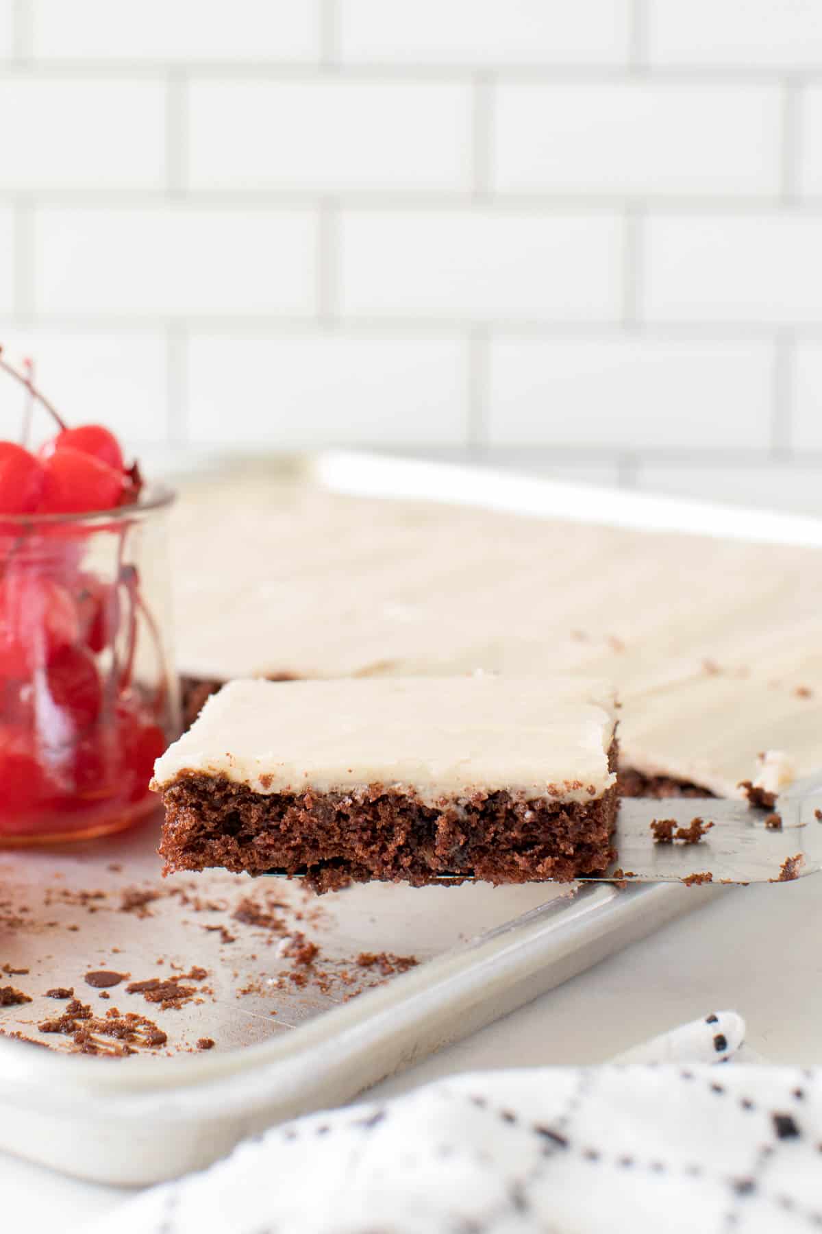 root beer float sheet cake piece on a serving spatula