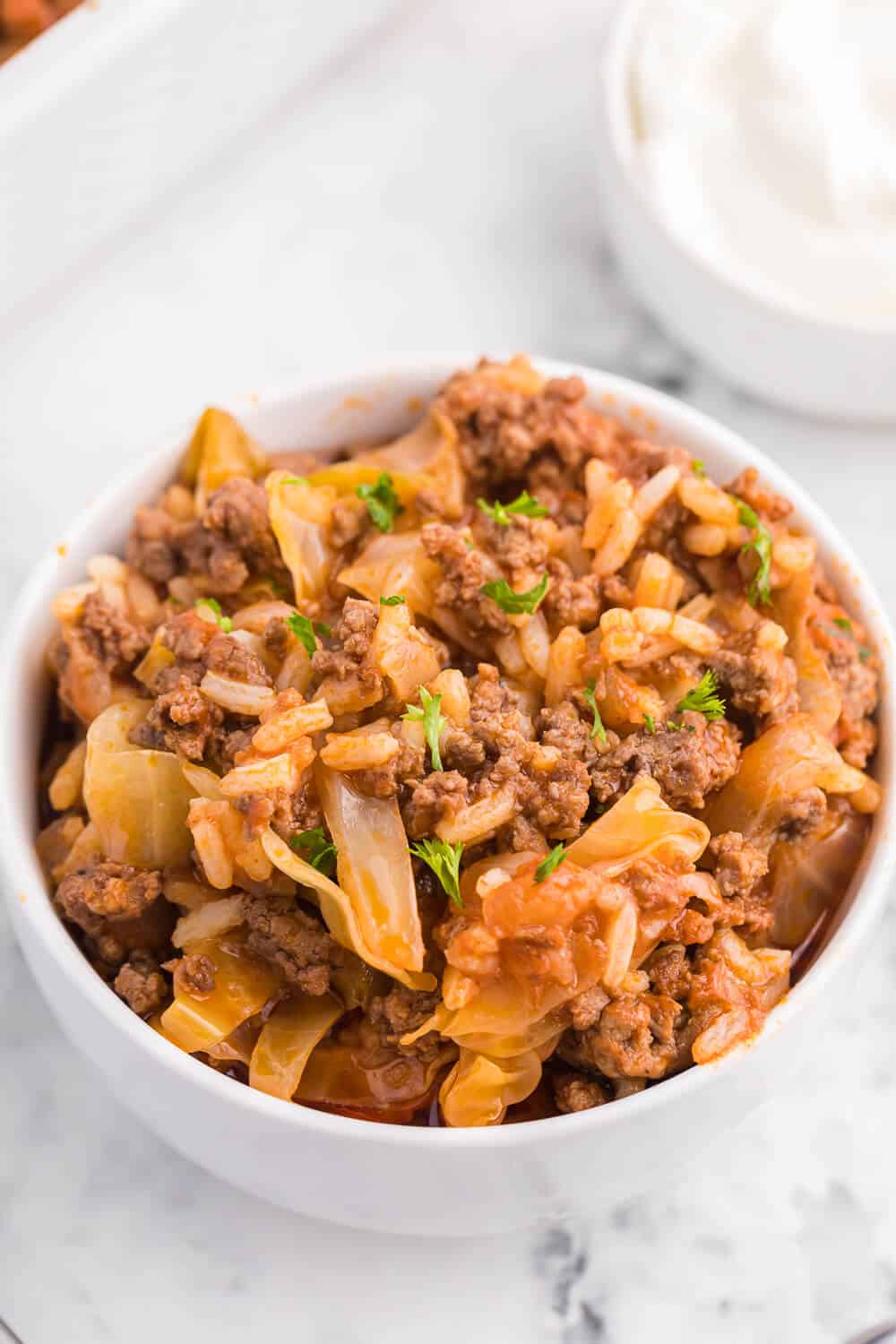 Cabbage roll casserole in a white bowl.