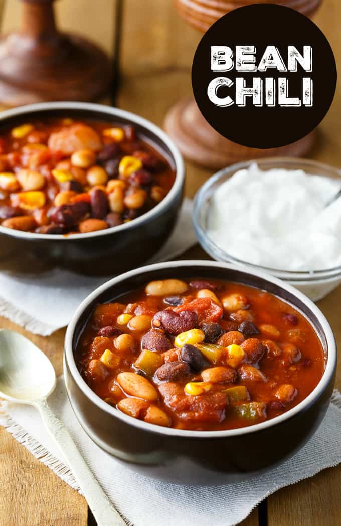 Bean Chili - The heartiest meat-free chili recipe! Use four different kinds of canned beans in this comfort food classic with peppers, corn, and tomatoes.
