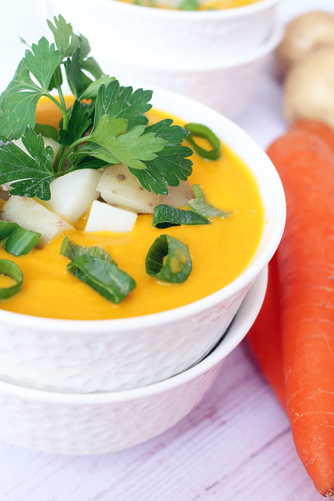 Carrot and Potato Soup - This super creamy vegetarian soup is filled with warm flavors of sweet carrots and yummy potatoes with ginger, parsley, and sour cream.