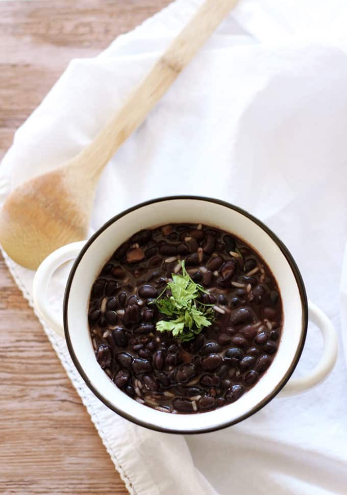 Slow Cooker Black Beans - Make the best dried black beans in the Crockpot! This bean recipe requires no soaking and simmers all day while you're at work for the easiest Taco Tuesday side dish.