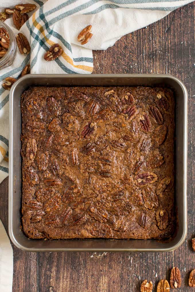 Maple Pecan Squares - Ooey gooey YUM! This easy bar recipe is a cross between a butter tart and pecan pie. Prepare to lick your fingers from this mouthwatering dessert.