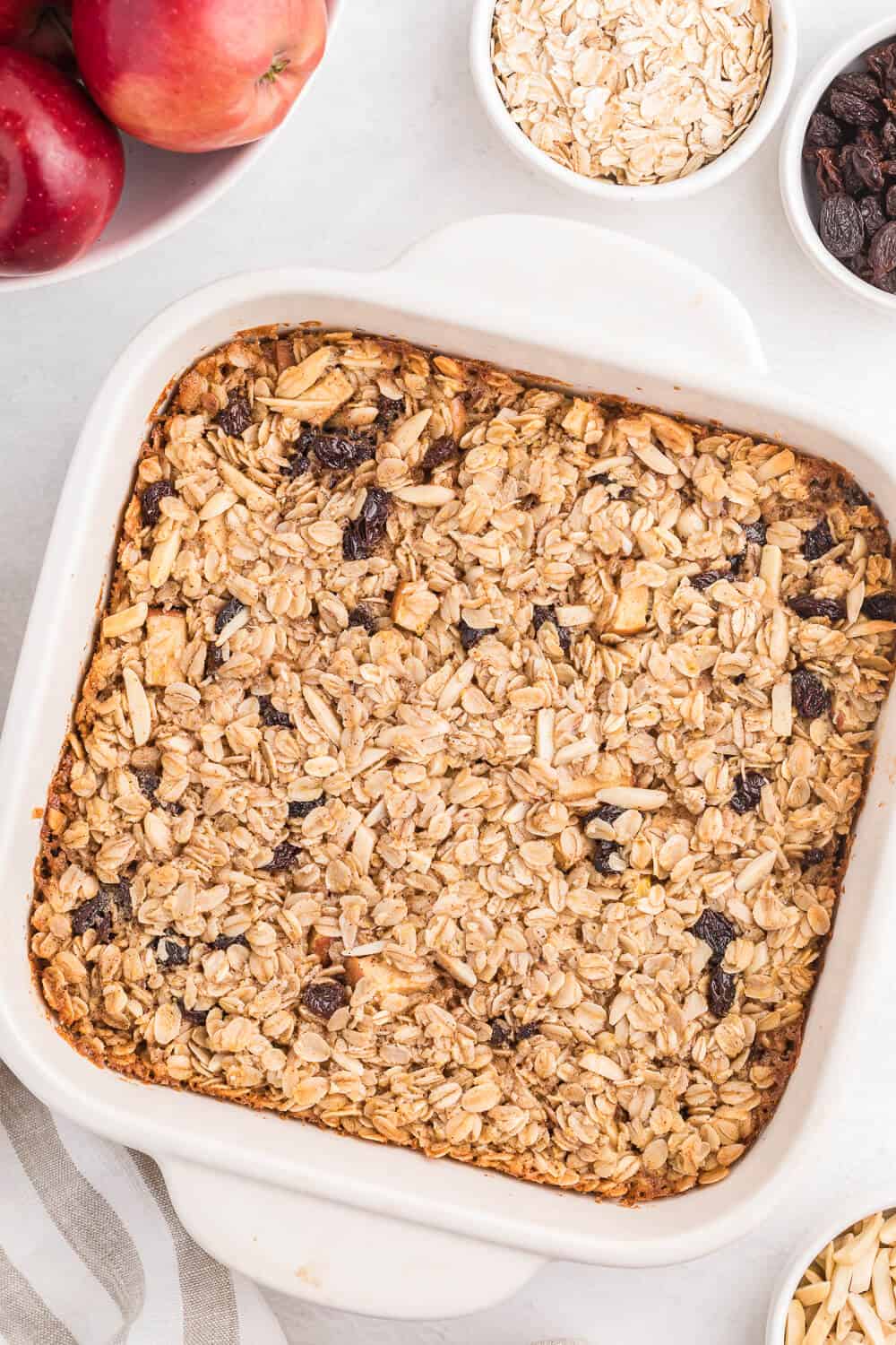 Oatmeal Casserole - This baked oatmeal is hearty, warm and filling. Loaded with apples, raisins and almonds, or whatever your favourite additions are, the whole family is sure to enjoy it!