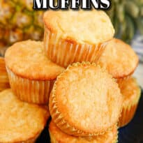 Pina colada muffins piled on a plate.