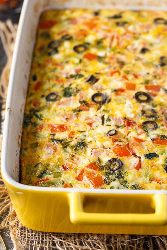 Mediterranean Brunch Bake - Packed with the distinct flavours of the Mediterranean, including salty feta and olives, fresh herbs and loads of veggies, this is the perfect vegetarian brunch dish!