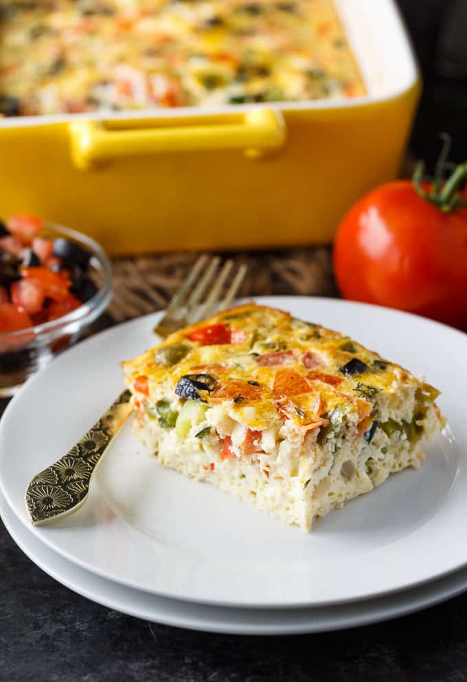 Mediterranean Brunch Bake - Packed with the distinct flavours of the Mediterranean, including salty feta and olives, fresh herbs and loads of veggies, this is the perfect vegetarian brunch dish!