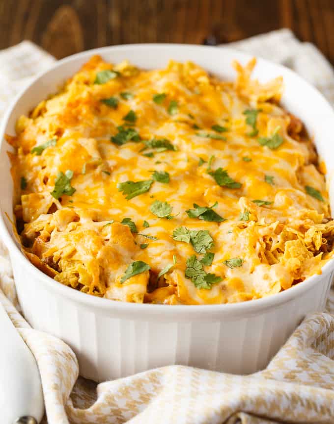 Beef Nacho Bake - This beefy nacho casserole is a welcome change from the traditional Taco Night. It hits all the right notes with cheese, beef, salsa and crunchy tortilla chips.