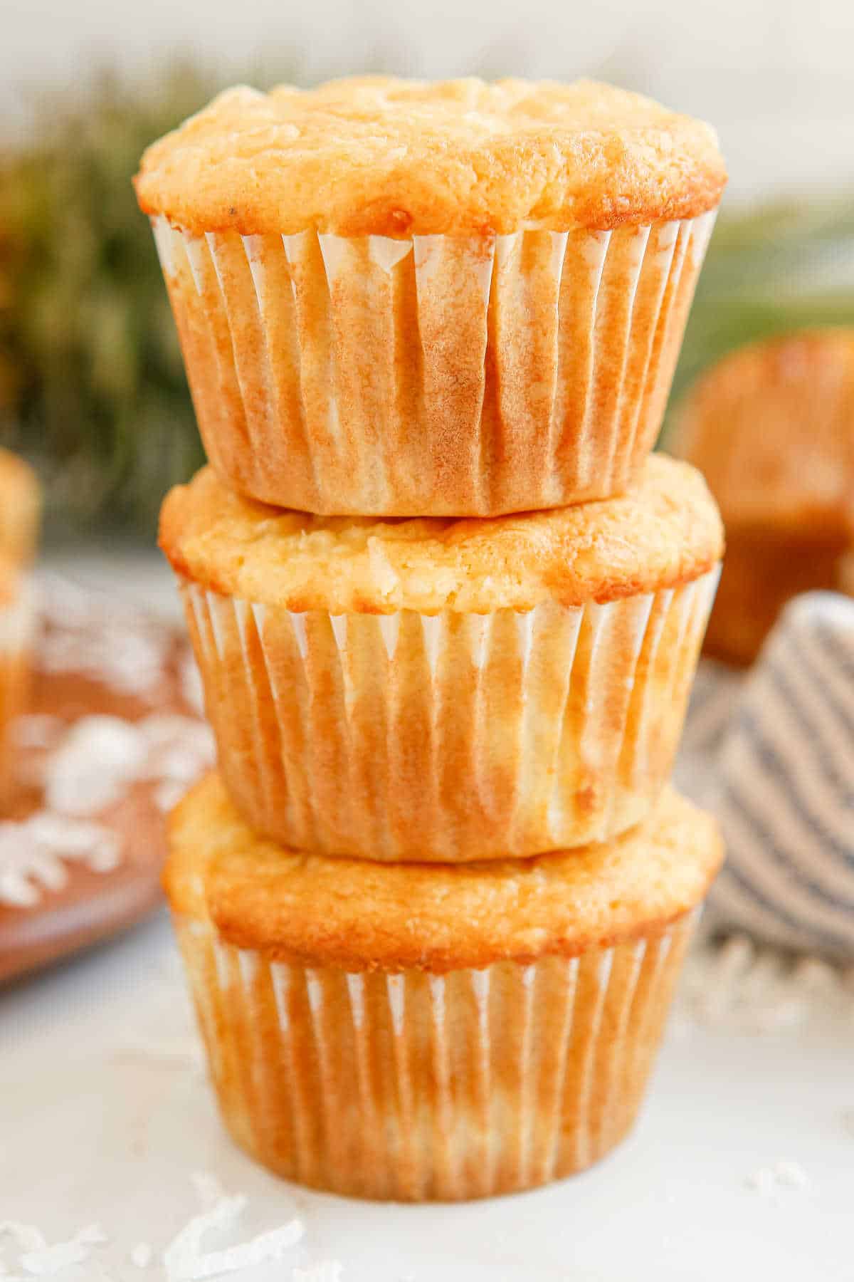 Three stacked pina colada muffins.