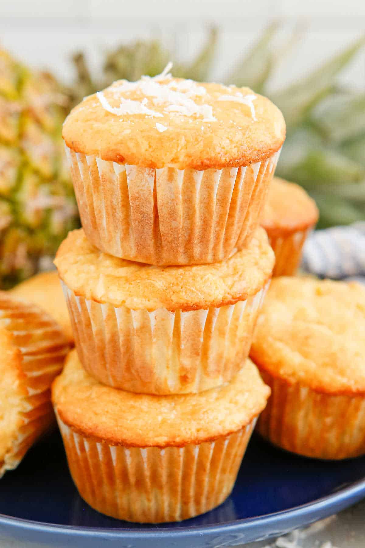 A stack of three pina colada muffins.