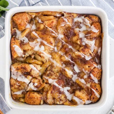 Apple Cinnamon Bun Breakfast Casserole - A sweet way to start your day and feed your guests! It's made with cinnamon buns + apple pie filling for a mouthwatering breakfast casserole you'll make again and again.