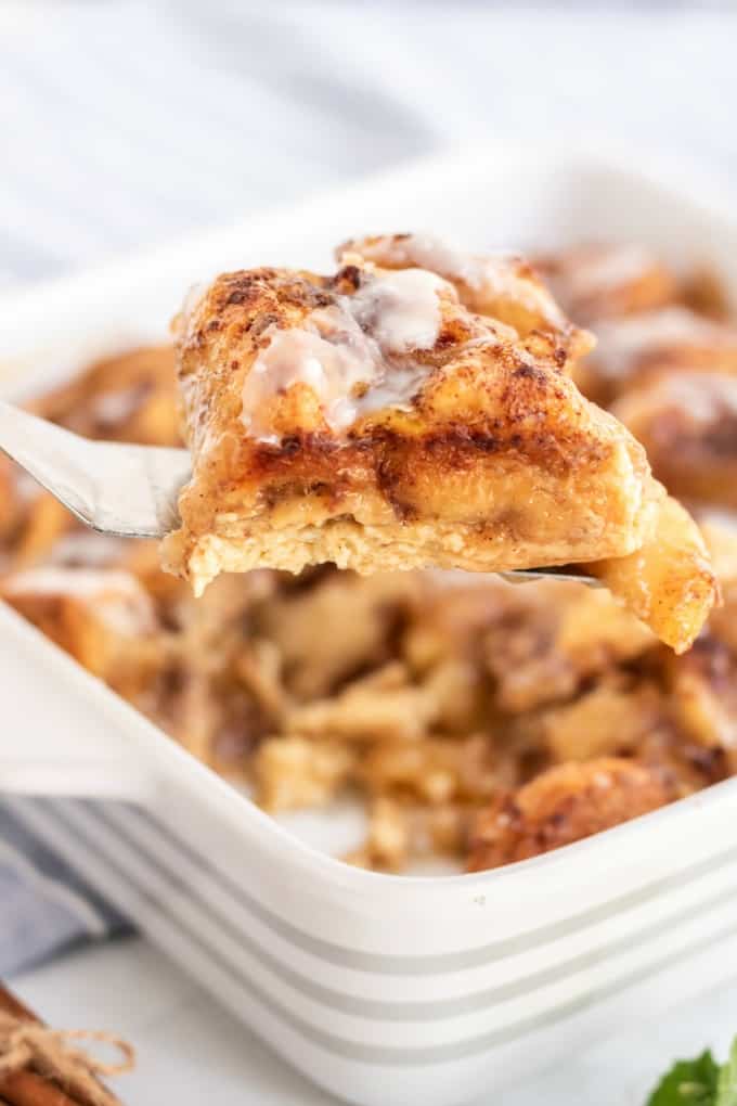 Apple Cinnamon Bun Breakfast Casserole - A sweet way to start your day and feed your guests! It's made with cinnamon buns + apple pie filling for a mouthwatering breakfast casserole you'll make again and again.