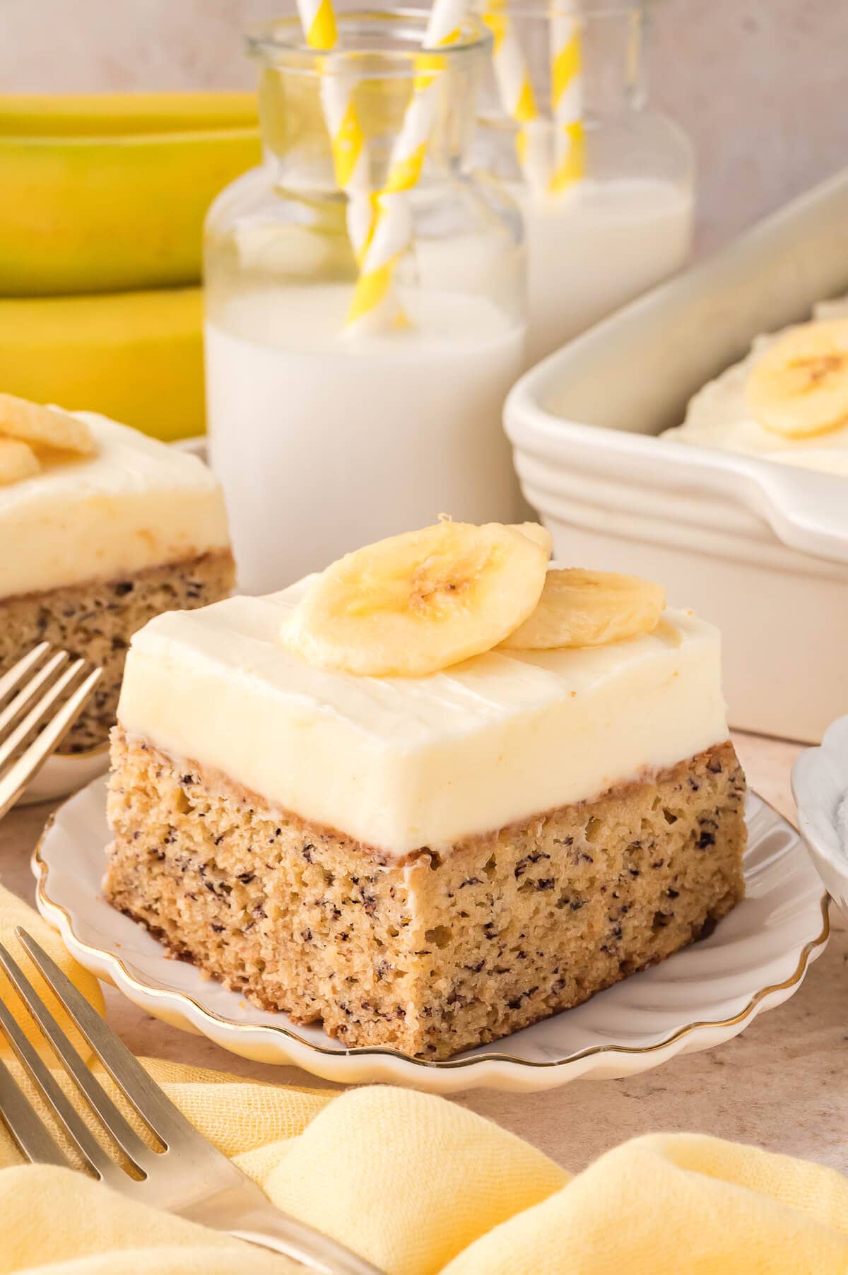 A slice of banana cake on a plate.
