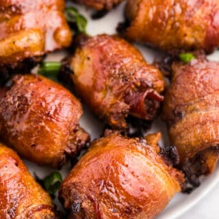 Stuffed Bacon Rolls - A great party appetizer! Smoky bacon wrapped around juicy meatballs for a meaty snack.