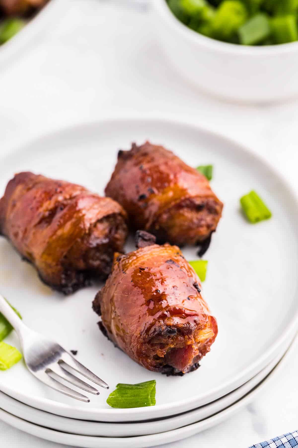 Stuffed Bacon Rolls on a small plate.