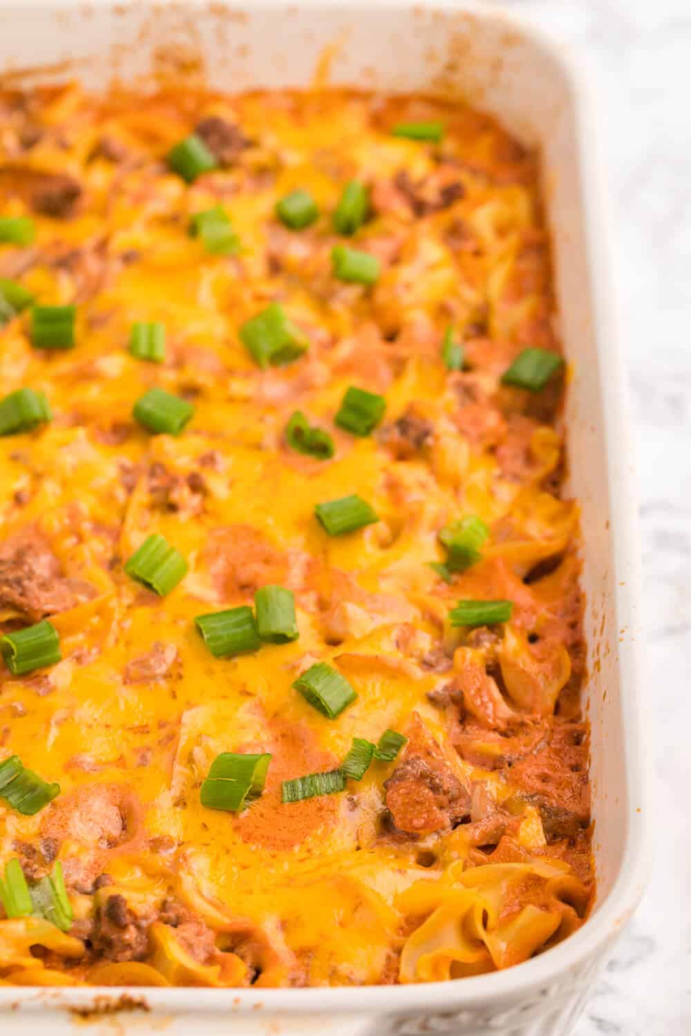 Beef Noodle Bake - This beefy pasta casserole, with crowd pleasing flavours of cheese, garlic and sour cream, is the perfect make-ahead dish for feeding a large group.