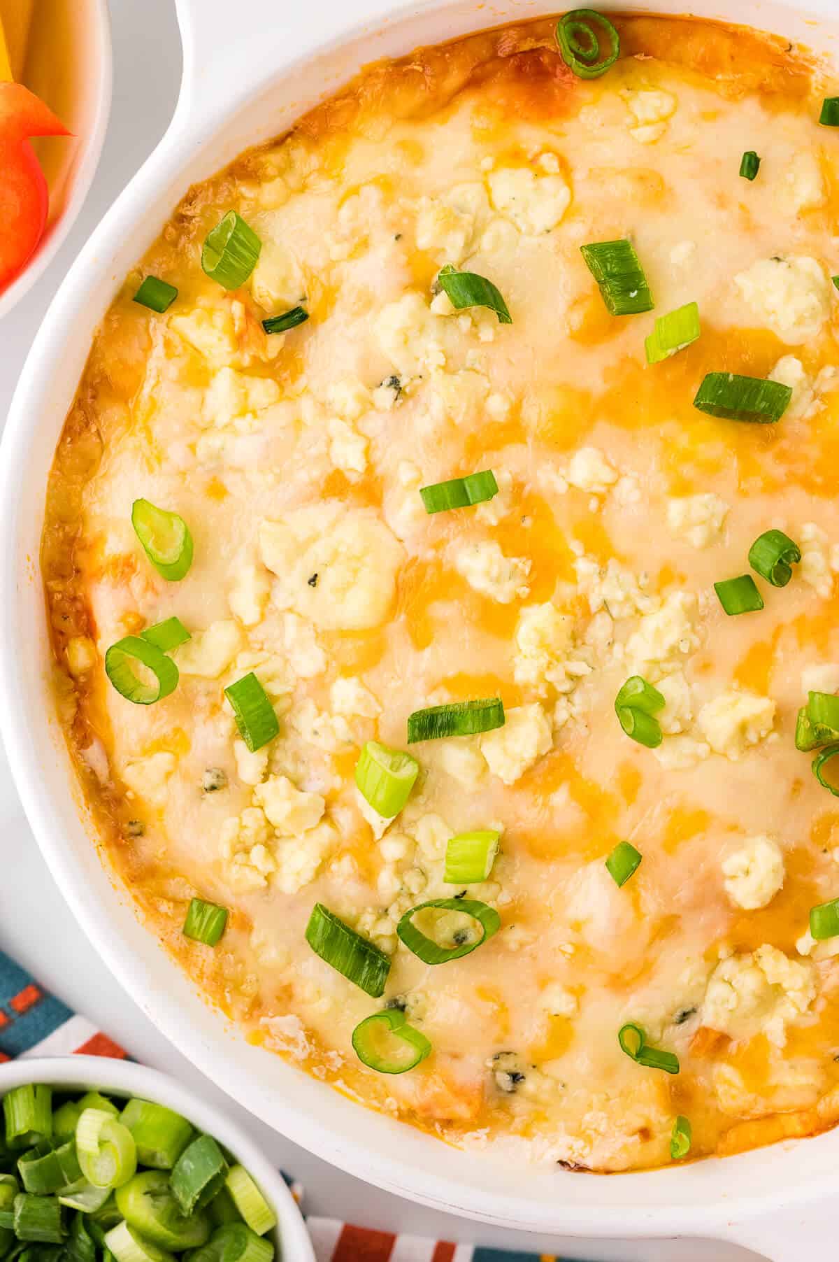 Buffalo chicken dip in a white dish.