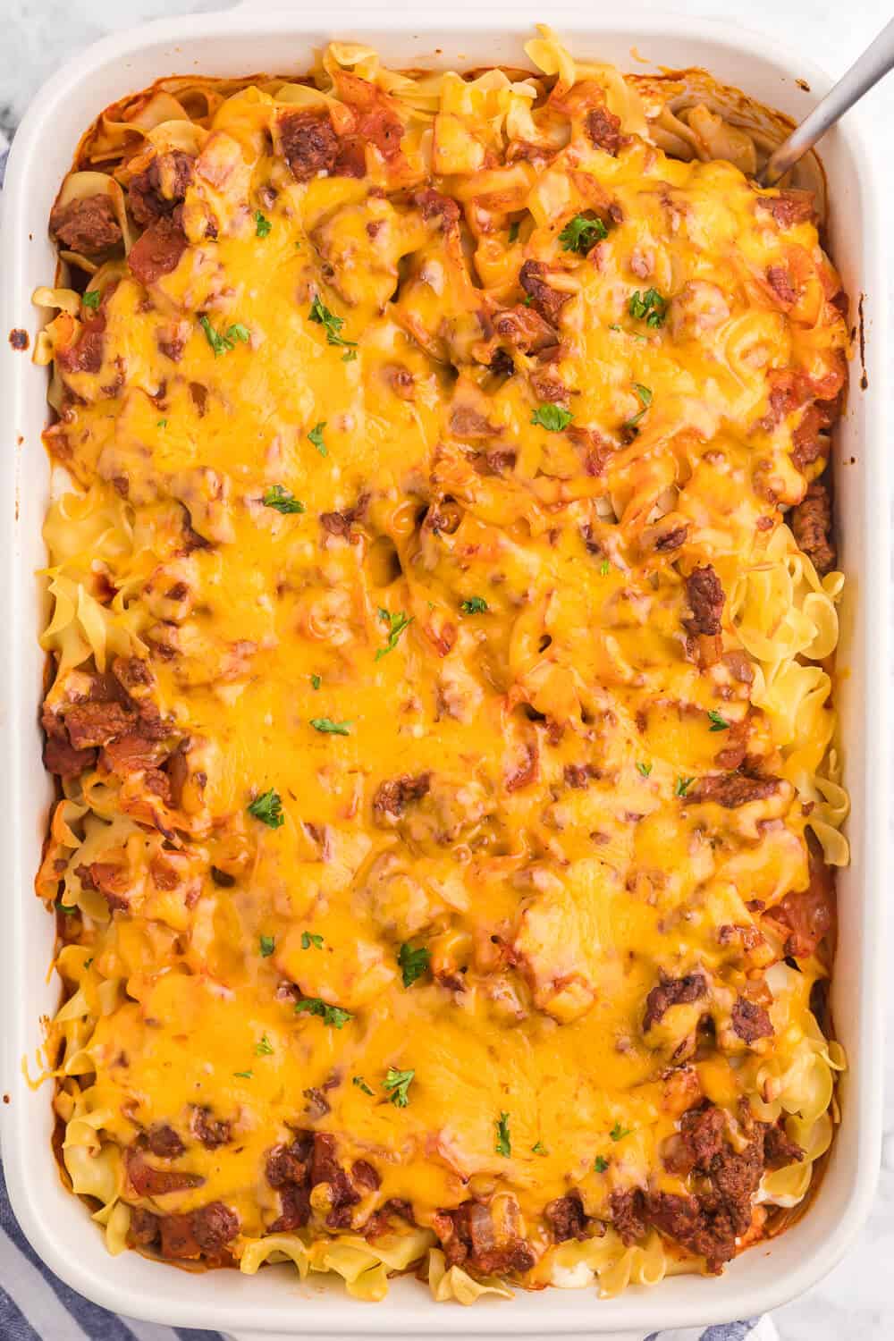 Cheesy Hamburger Supper - This casserole might remind you of a lasagna. It has the same cheesy tomato flavours, but the addition of cream cheese makes it even better!