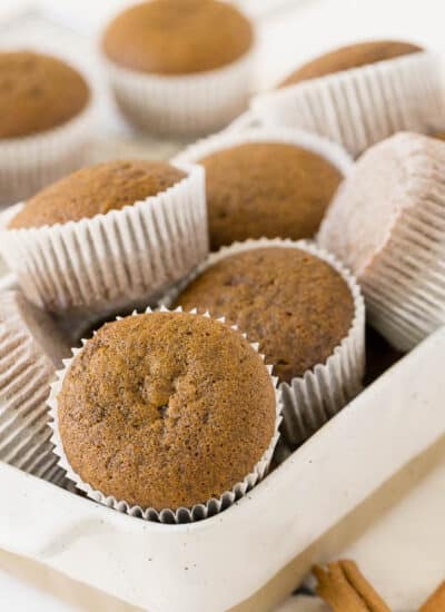 Gingerbread muffins in a white container.