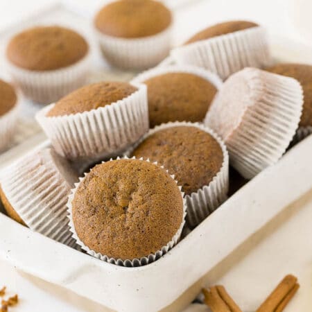 Gingerbread muffins in a white container.